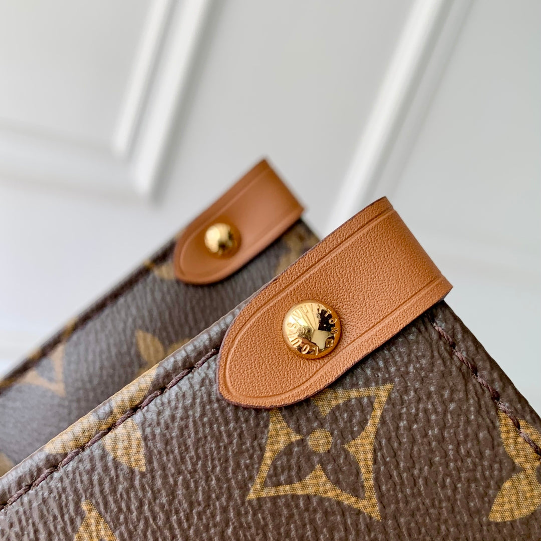 ORGANISATEUR ONTHEGO 37 EN TOILE ENDUITE MARRON ET CUIR DE VEAU