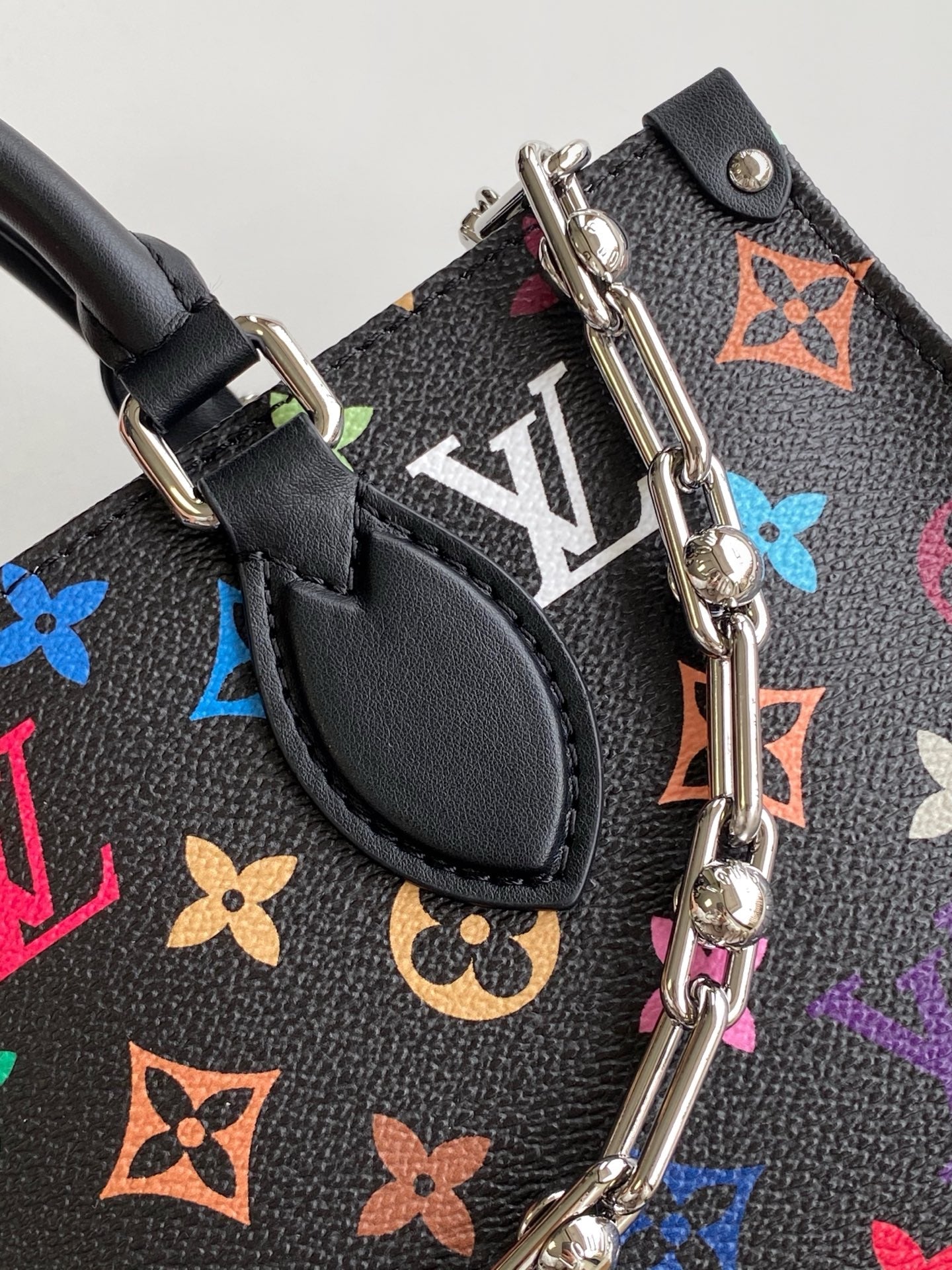 SAC ONTHEGO EST-OUEST 25 EN TOILE À MOTIFS MONOGRAMMES COLORÉS