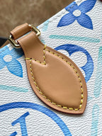 TOILE ONTHEGO EST OUEST 25 EN BLEU LAGON MONOGRAMME