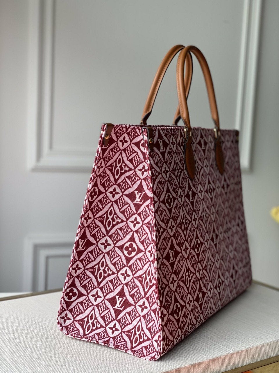 LV DEPUIS 1854 ONTHEGO GM TEXTILE ROUGE BORDEAUX